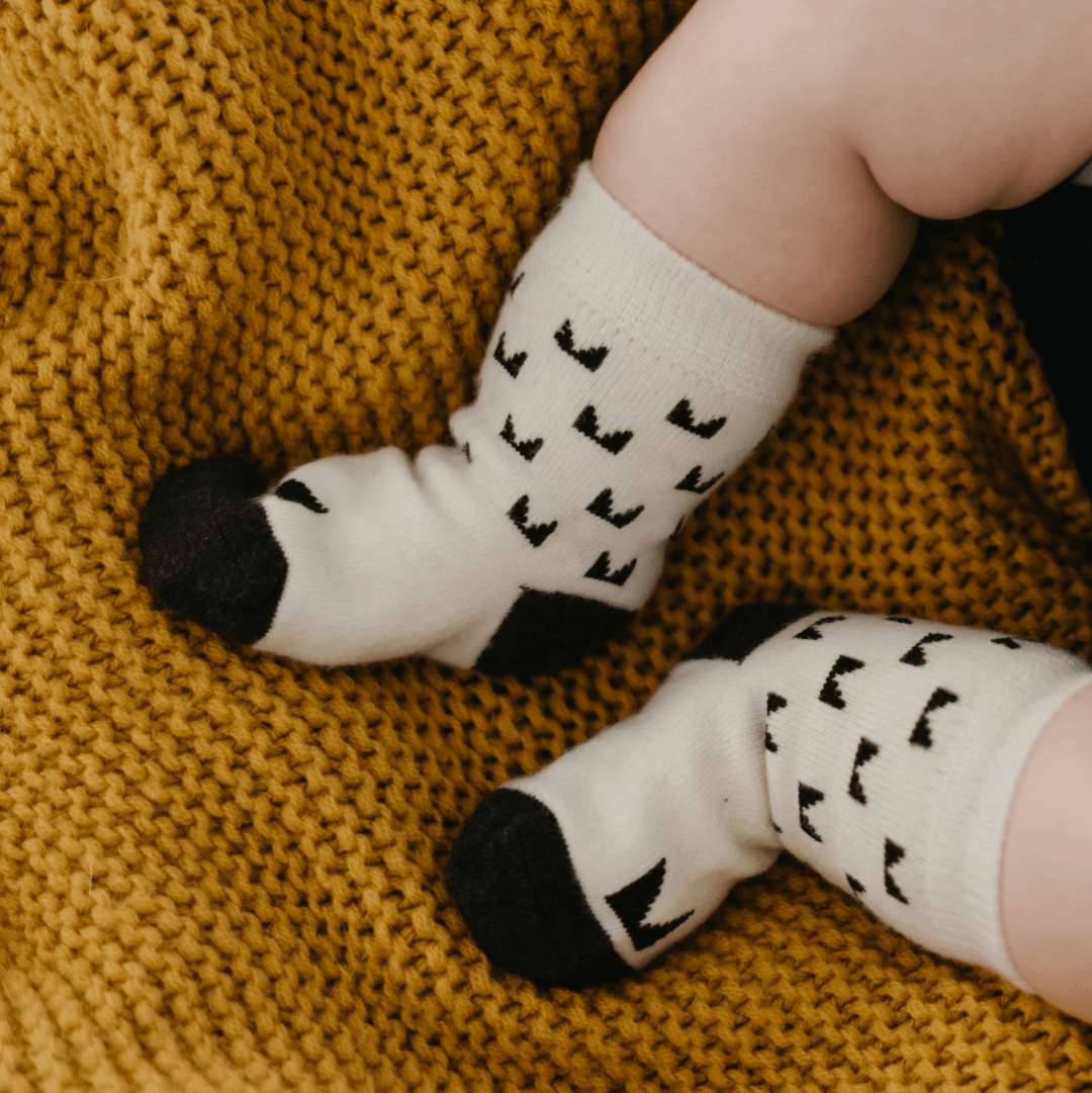 https://chatgpt.com/c/6a470d5b-da60-83ec-a019-f12d30428034#:~:text=Baby%20wearing%20Mosey%20by%20Lamington%20merino%20baby%20socks%20in%20cream%20with%20black%20pattern.