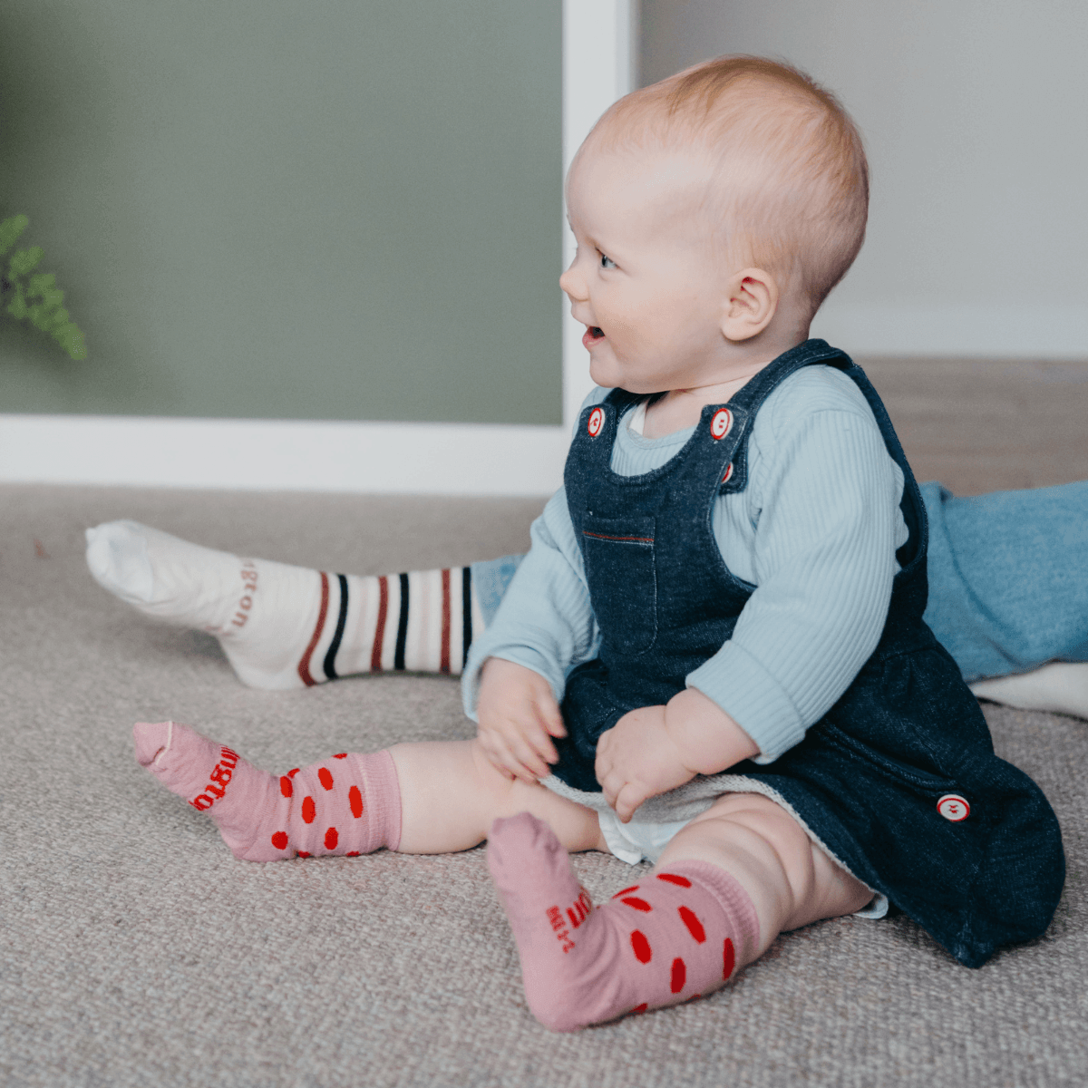 Lamington baby merino crew socks in soft pink with cherry red spots made in New Zealand.