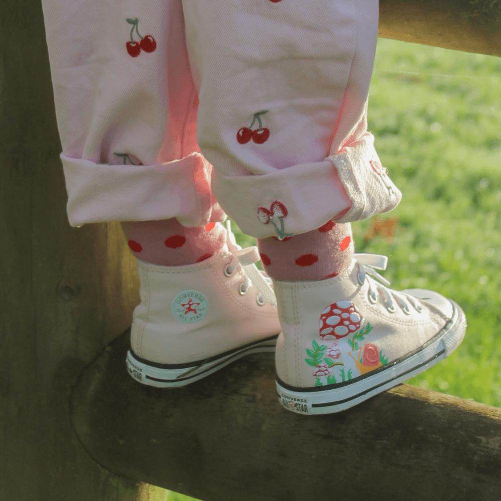 Lamington children's merino crew socks in soft pink with cherry red spots made in New Zealand.