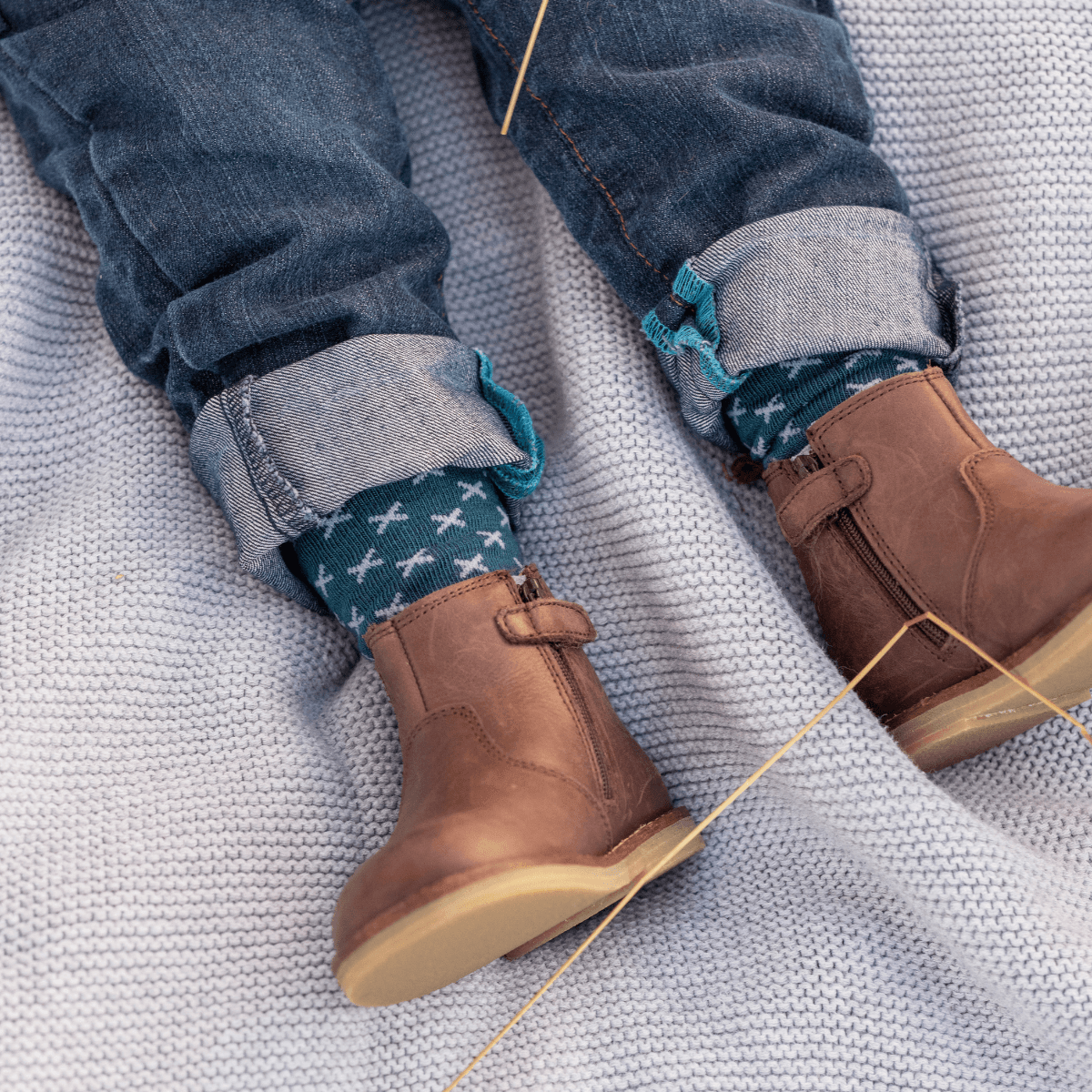 Lamington baby merino knee high socks in deep teal with light blue cross pattern made in New Zealand.