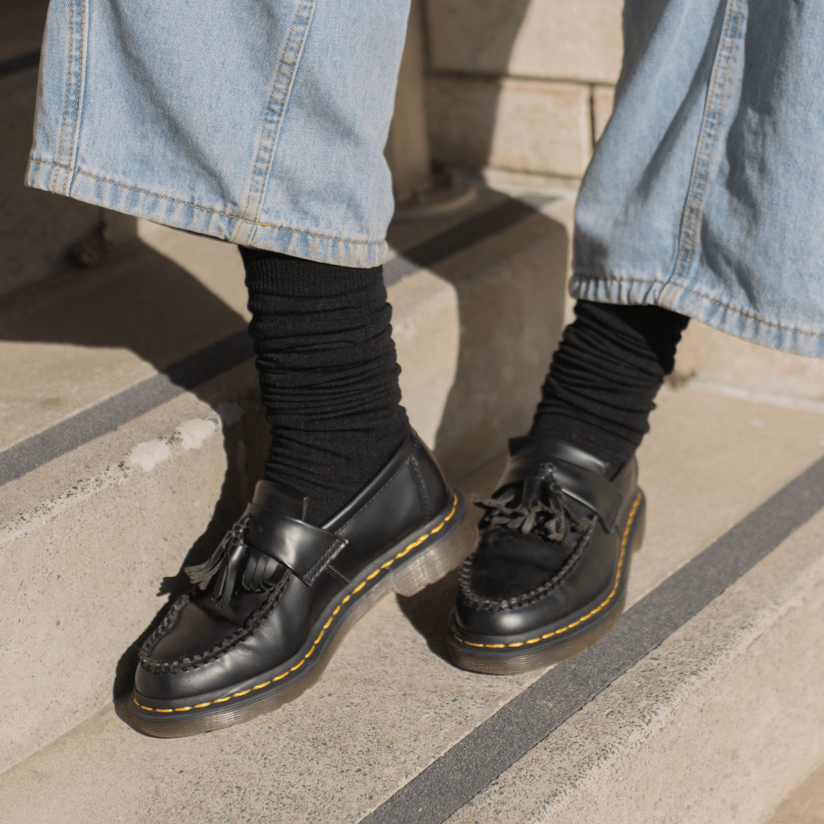 Lamington Merino Wool Socks styled with black boots for an autumn look.