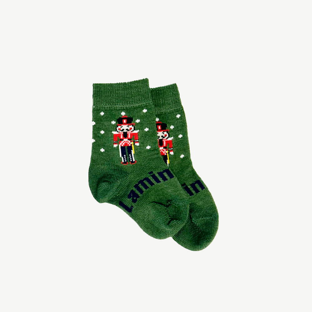 Lamington baby merino crew socks in green with white spots and nutcracker design made in New Zealand.