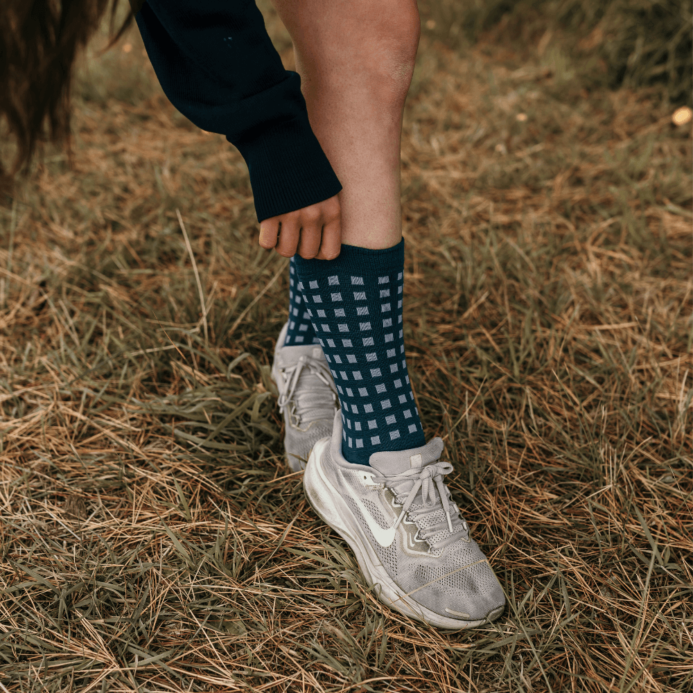 Lamington women's merino crew socks in deep teal with light blue grid pattern made in New Zealand.