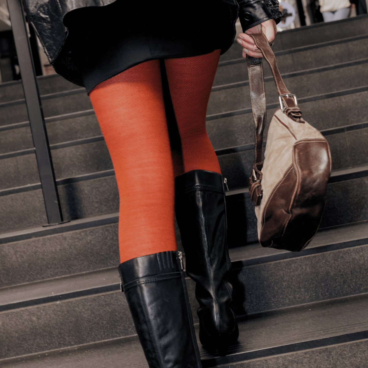 woman wearing rust merino wool tights city aus
