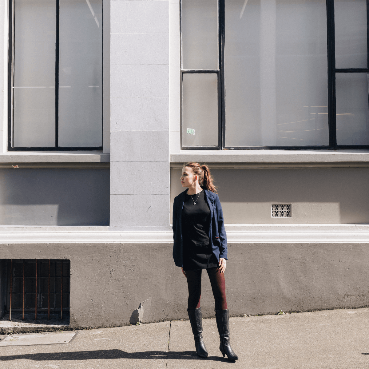 woman in city wearing merino wool tights maroon aus