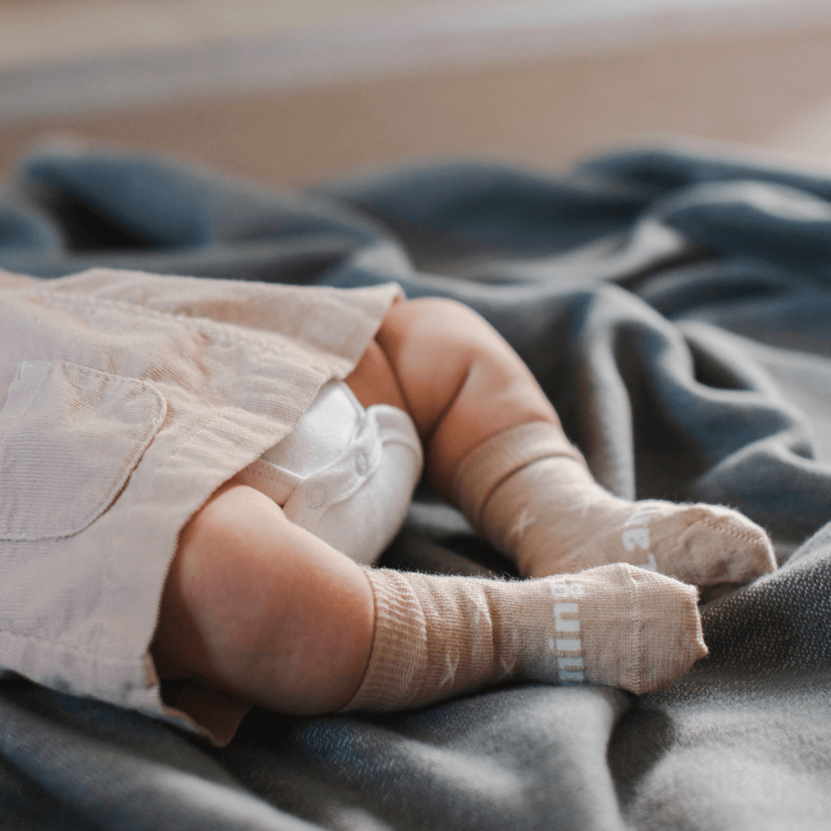 Merino Wool Crew Socks for Baby in Ted, Oatmeal color, shown on baby's feet.